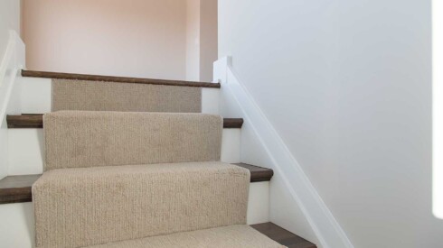 Detailed view of stairs with carpet