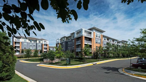 Parking and view of Falls at Flint Hill apartment buildings