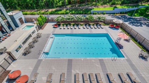 Aerial view of the resort style swimming pool at the Windmill Parc apartments